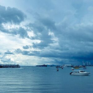 A beautiful shot over the Andaman Sea with boats in the foreground and cloudy skies in the background